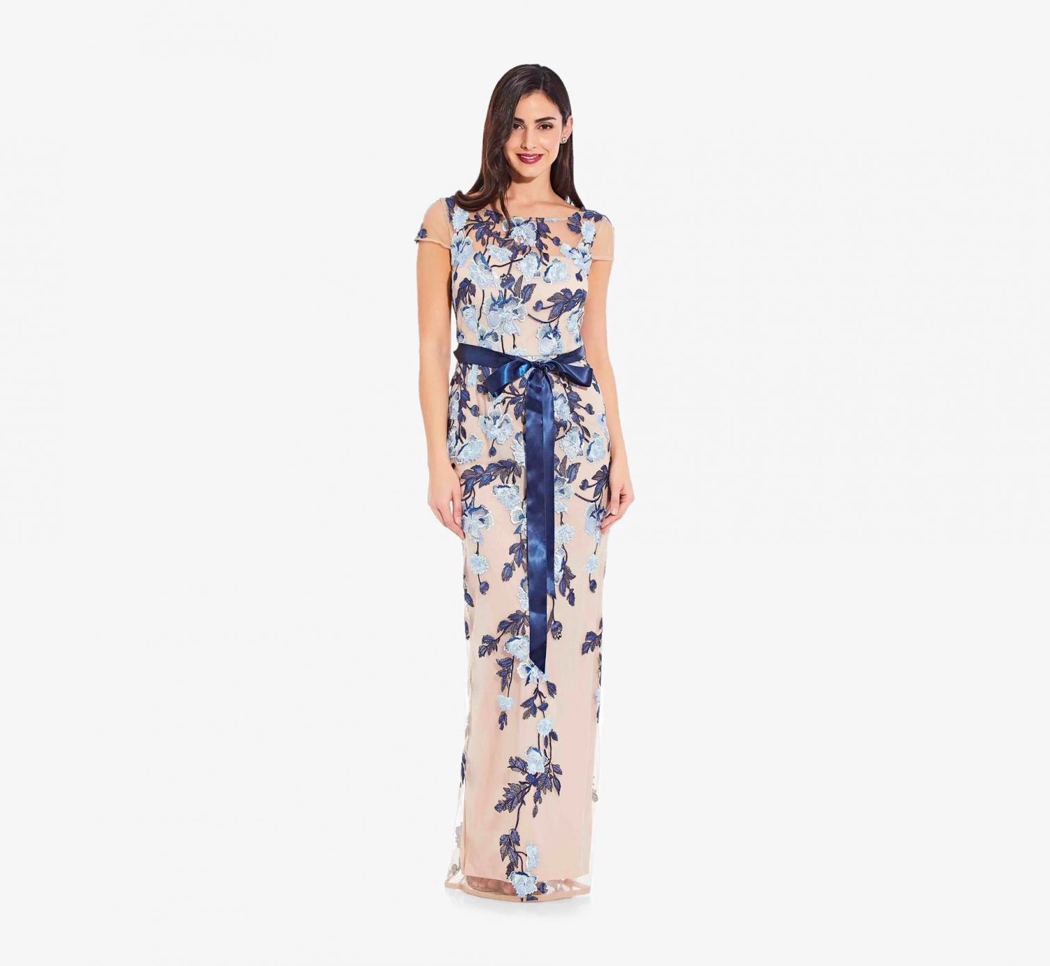 Long Floral Beaded Gown With Flutter SleevesShop Now →