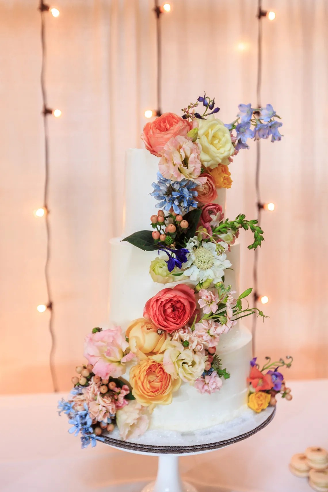 Tall Tiered Wedding Cake with Rainbow Florals