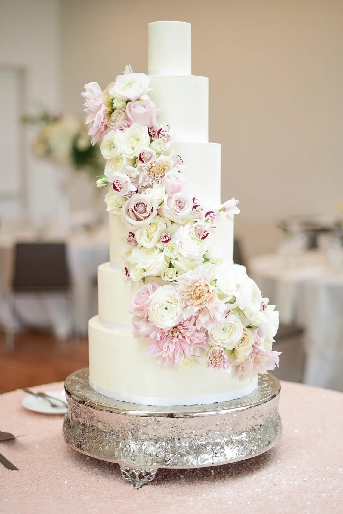 Tall Tiered White Wedding Cake with Cascading Florals