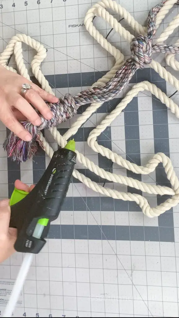 Step 3. Secure dog toy with colorful rope